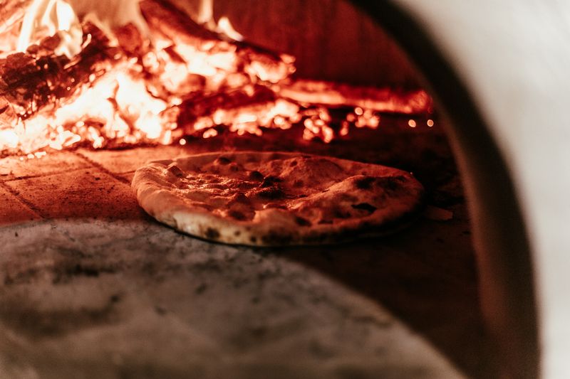 anthony coal fired pizza kitchen and coal-fired oven in action